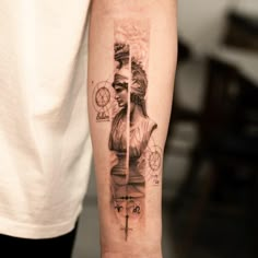 a person with a tattoo on their arm holding a clock and compass in his hand