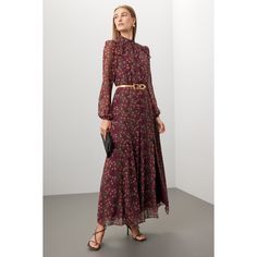 Red floral cotton (100% Silk). Lining (100% Polyester). A-line. Long sleeves. Mock neck. Back zipper closure. 55" from shoulder to hemline. Imported. Burgundy Floral Print Dress For Spring, Feminine A-line Maxi Dress For Fall, Red Maxi Dress For Workwear In Fall, Floral Print Maxi Dress For Fall Daywear, Fall Floral Print Maxi Dress For Daywear, Elegant A-line Floral Dress For Fall, Chic Burgundy Maxi Dress For Fall, Chic Floral Dress For Fall Daywear, Chic Fall Daywear Floral Dress