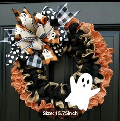 a halloween wreath with a ghost on it