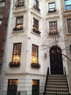 an apartment building with many windows and balconies