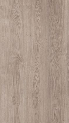 an image of wood grained surface with light brown tones and dark gray streaks on it