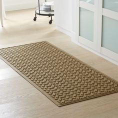 a brown rug on the floor in a room