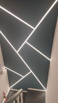 the ceiling is decorated with white lines and lights