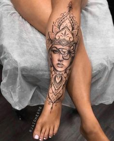 a woman's leg with a tattoo on it