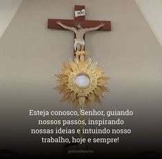 a crucifix with the words jesus on it and an image of a person holding a cross