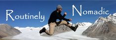 a man jumping up into the air in front of mountains