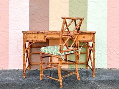 a chair and desk in front of a colorful wall