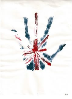 the british flag is painted on top of a white paper with red, white and blue ink