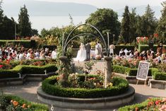 a wedding ceremony in the middle of a garden