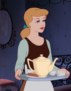 a woman holding a plate with a tea pot on it