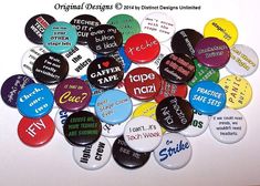 a pile of buttons that say different types of words and phrases on them, all in various colors