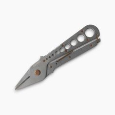 a knife with holes in it on a white background