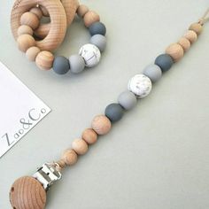 a wooden bead necklace and bracelet on display