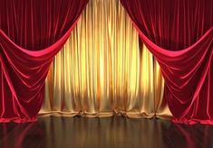 an image of a stage setting with red drapes and gold curtaines on the wall