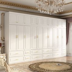 a large white closet with chandelier in the middle and rug on the floor