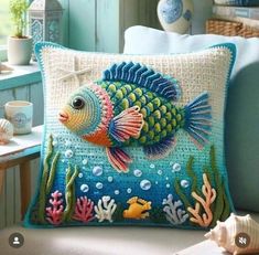 a blue pillow with a fish on it