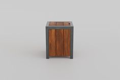 a small wooden cabinet with metal legs