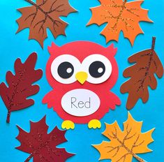 an owl and some leaves on a blue background with the word red written in it