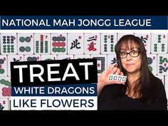 a woman holding up a piece of paper with the words treat white dragon like flowers on it