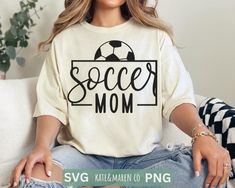 a woman sitting on a couch wearing a soccer mom shirt