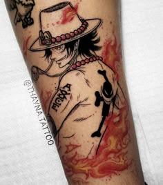 a person with a hat and tattoos on their arm