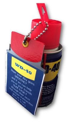 a red and yellow tag attached to a can of wd - 40 with a metal ball chain