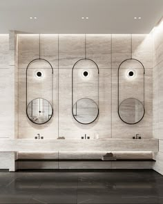 a bathroom with three sinks and mirrors on the wall