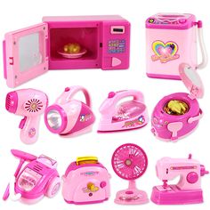 a pink toy kitchen set with appliances and accessories