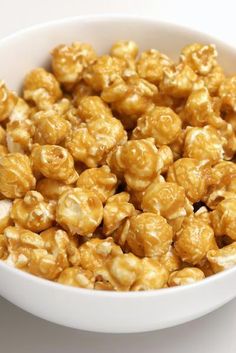 a white bowl filled with caramel popcorn