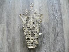 a wire basket hanging on the wall