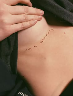 a woman's stomach with writing on it