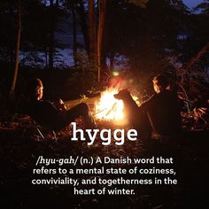 two people sitting around a campfire with the words hygge