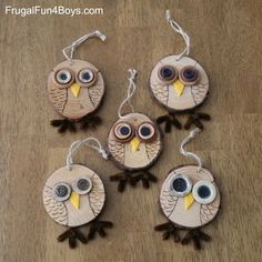 four owl ornaments made out of wood with googly eyes