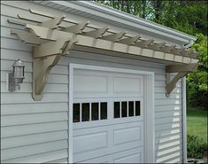 a white garage with an attached awning