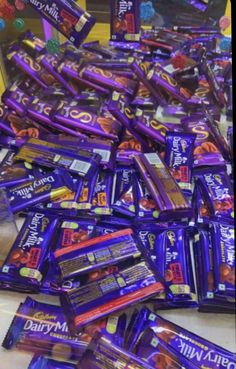 a pile of chocolate bars sitting on top of a counter