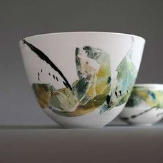 two bowls sitting side by side on a table