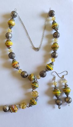 "This listing is for Handmade Recycled Paper Bead Necklace and Earrings set.  All necklace set are one of a kind. Once sold out, we will not have the exact same color set available.  Paper beads are made from food packaging box. I have tried my best to make the beads as even as possible but due to them being Handmade there may be a small size difference.  Paper bead size: 1/2\" Necklace length: 20\" not the dangle Earring length: 3\" Please note: The images for the beads are zoomed in so they ma Paper Bead Earrings, Paper Bead Necklace, Earrings Paper, Make Paper Beads, Paper Beads Necklace, Paper Bead Jewelry, 2 Necklace, Size Difference, Paper Jewelry