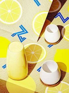 an image of lemons and cups on a table