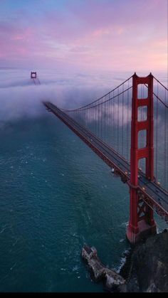 the golden gate bridge is surrounded by fog