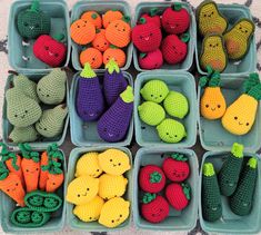 many crocheted fruits and vegetables are arranged in small baskets on the floor,