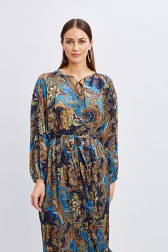 Chic & sophisticated, Elie’s favorite Paisley print gives our midi dress an artistic edge. Designed with a self-sash, blouson sleeves & an elastic waist, this paisley print midi dress exudes a sense of free-spirited elegance. T-Tahari Paisley Printed Long Sleeve Midi Dress 100% Polyester Georgette Runs true to Size Model is 5'9" and wearing size S Dry Clean Only Imported Style #: THF4D021 Tahari Dress, Dresses Royal, Print Midi Dress, Paisley Dress, Long Sleeve Short Dress, Sleeve Midi Dress, Black Friday Shopping, Free Spirited, Long Sleeve Midi