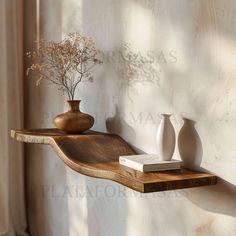 two vases are sitting on a wooden shelf