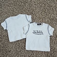 New Without Tags Von Dutch Graphic T-Shirt. Size 6 Months Baby/Kids/Toddler Tee With Incredible Amount Of Stretch. Kustommade Von Dutch Originals. Off White Or Cream Color With Blue Graphic And Contrast Stitching Detail. 100% Cotton. Made In U.S.A. Machine Washable. Super Comfy, Super Cute Top. Several Other Sizes And Styles Of Von Dutch Tops In My Store. Smoke Free And Pet Free Home. Please Check Out My Other Items...I'd Love To Make A Discounted Bundle For You. Thank You!! Von Dutch Pants, Von Dutch Shirt Outfit, Von Dutch Skirt, Von Dutch Mini Skirt, Von Dutch Shirt, Von Dutch, 6 Month Baby, Yellow T Shirt, Sweatshirts Pattern