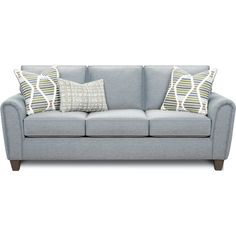 a light blue couch with two pillows on it and one pillow in the middle of the sofa