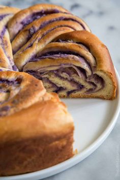 a purple swirl cake on a white plate