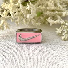 Silver & Pink Swoosh Ring 

These are one of my best sellers! 

Available in size 9

Made of Titanium steel won’t fade or tarnish 

#swoosh #nike #rings #gold

 #jewelry Rings Gold, Women Accessories Jewelry, Women's Jewelry, Best Sellers, Women's Accessories, Nike Women, Gold Jewelry, Silver Jewelry, Jewelry Rings