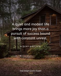 a cabin in the woods with a quote from albert finsten on it that reads, a quiet and modest life brings more joy than a pursuit of success