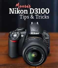 a camera sitting on top of a wooden table with the words nikon d700 tips and tricks