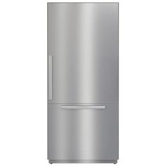 a silver refrigerator freezer sitting on top of a white wall