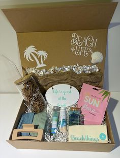 the beach box is packed with items to be used for an ocean themed party or gift